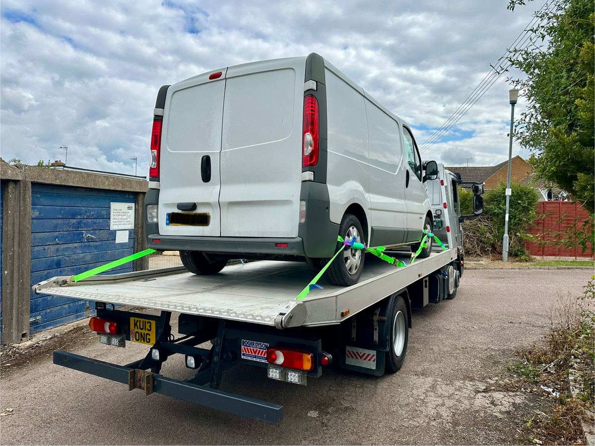 Van breakdown recovery: van strapped and secured on the flatbed